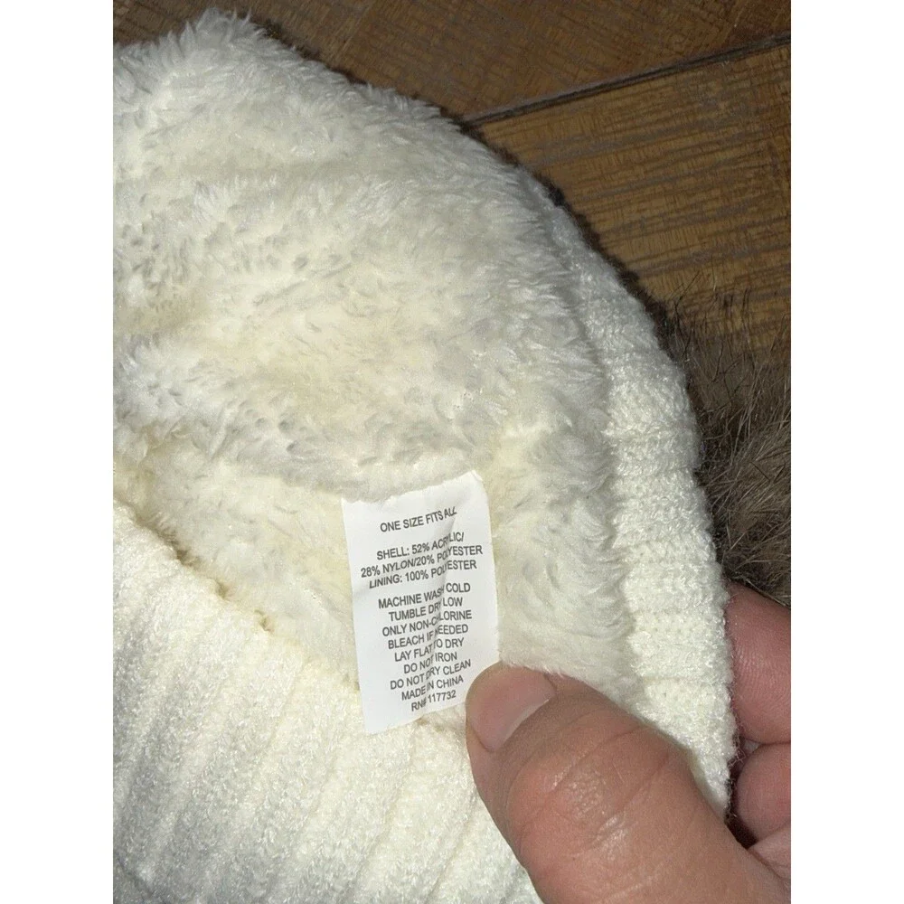ZeroXposur women's cream knit beanies with a faux fur pom-pom